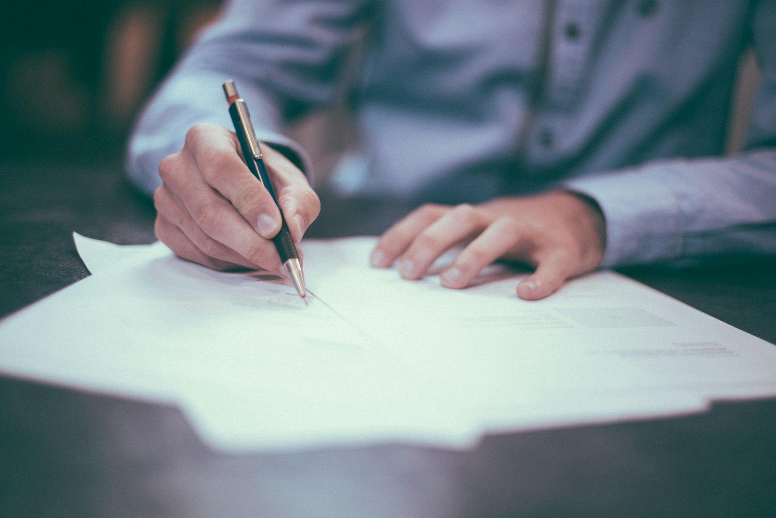 Documents being signed at the Vakeel Junction chambers